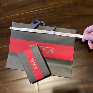 Tumi box, dust pouch and paper bag